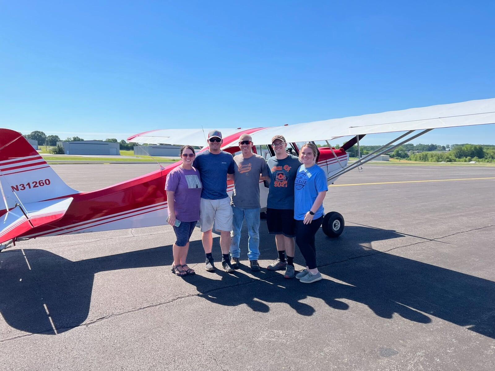 family celebrating first solo flight