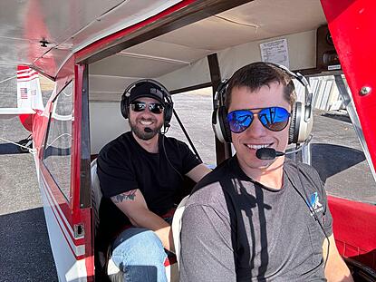 flight instructor Drew Yoder with a tailwheel student in the champ